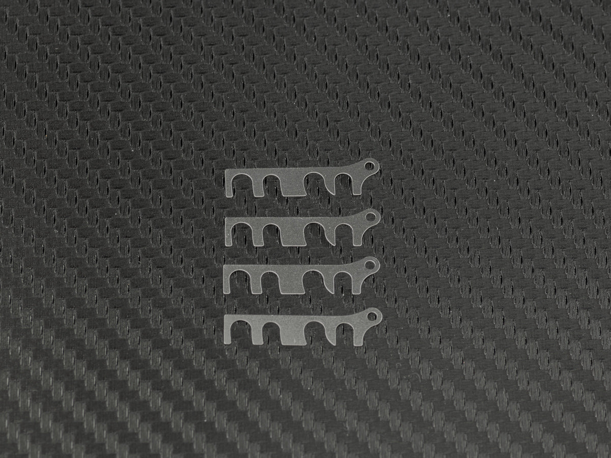 T200 - 0.2 - LOWER SUSPENSION BLOCK SPACER FR 0.2mm (SUS/4pcs)